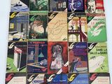a lot of books that are stacked on top of each other