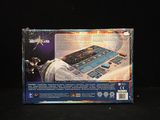 a box with a board game on it on a black surface