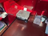 an image of a red locker with a laptop in it