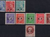 a close up of a group of stamps on a black surface