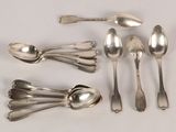 several spoons and spoon spoons are arranged on a white surface