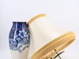 pair of blue and white vases and a lamp on a white background