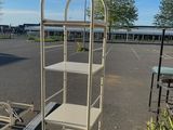 an image of a cart with a ladder in a parking lot