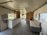 an image of a kitchen and living room in a mobile home