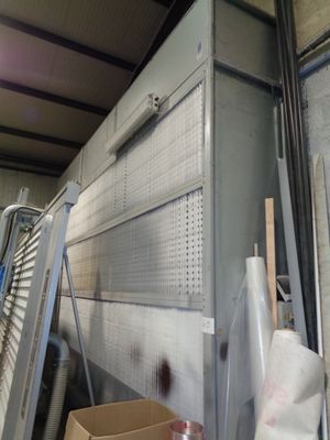 a large metal box sitting in the middle of a room