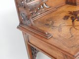 a wooden desk with a wooden chair on top of it