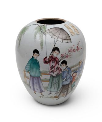 a vase with a picture of a woman and two children on it