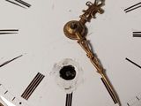 a close up of a clock with roman numerals on it