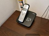 an image of a phone on a desk with a lamp