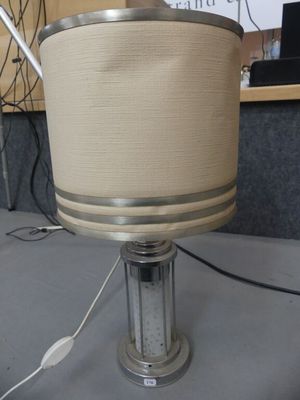 a lamp that is sitting on a table in a room