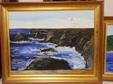 two paintings of a lighthouse and a body of water in a gold frame