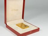 an image of a gold plated lighter in a red box