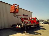 a red truck that is parked in front of a building