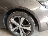 a close up of a car ' s tire on the ground