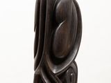 sculpture of a wooden sculpture on a white pedestal with a white background