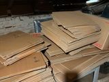 a pile of cardboard sitting on a table in a room