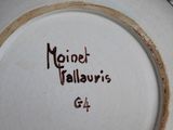 a close up of a plate with writing on it