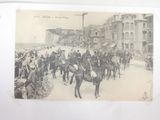 a lot of people that are riding horses in the street