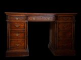an antique wooden desk with drawers and drawers on top of it