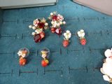 a lot of small flowers and fruit on the floor