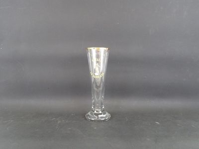 a glass vase that is sitting on a table