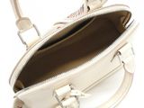 a white purse that is open on a white surface