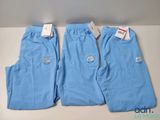 a pair of blue scrub pants sitting on top of a table
