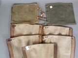 five bags of different colors and sizes on the table