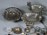 a lot of silver items that are on a table