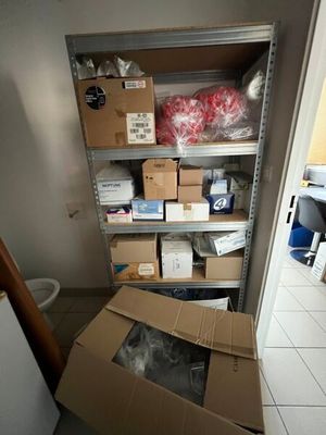 a room with a lot of boxes and boxes on the floor