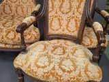 pair of victorian carved walnut armchairs with upholstered upholstered seats
