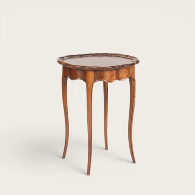 a small wooden table with a glass top on a white background