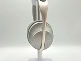 a white headphone on a stand with a white background