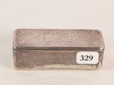 a small silver box with a number on it