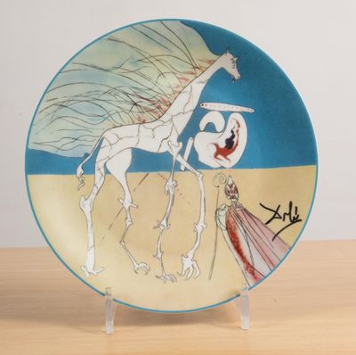 a plate with a picture of a woman and a giraffe on it