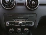 a car dashboard with a steering control and a shift button