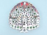 a silver peacock brooch with multi colored stones on it