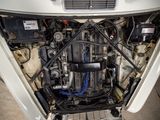 a picture of a car engine with its hood open