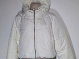 an image of a white jacket on a mannequin mannequin