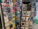 a display of books on a stand in a room