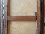 an old picture frame with a window on the inside of it
