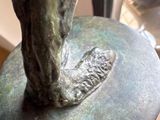 a statue of a horse that is standing on a table