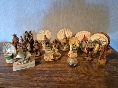many figurines that are sitting on a wooden table