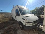 a white van that is parked on the side of the road