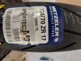 a close up of a motorcycle tire with a sticker on it