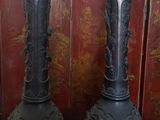 two vases that are sitting on a table