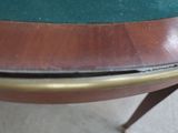a close up of a table with a green cloth on it