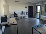 a room with a desk and a computer on it
