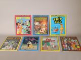 plusieurs livres pour enfants sont alignés sur une surface blanche