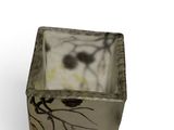 a small vase with a picture of a bird on it